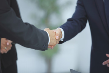 close up. handshake of business partners on blurred background