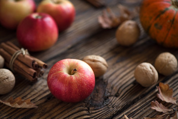 Autumn apples, pumpkin and cinnamon sticks