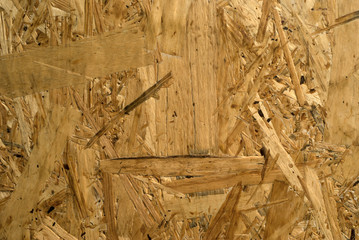 background, texture - surface of rough chipboard close-up