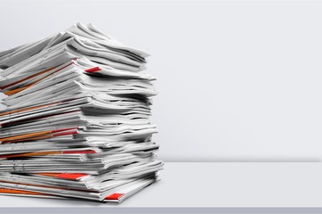 File folders with documents on white table