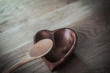 closeup. empty wooden salad bowl and wooden paddle