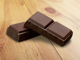 Two pieces of chocolate isolated on white background