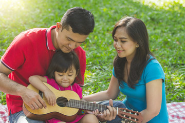Family music practice outdoors