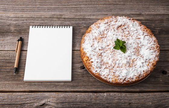 Homemade cake. There is a notepad to accommodate your recipe.