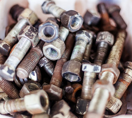 Old rusty bolts, abstract industrial background and texture