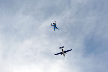Skydiving. Girl is in the sky.
