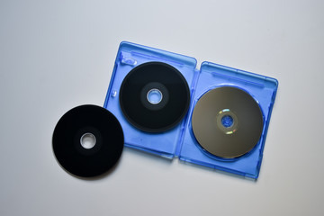 Blu-ray disc in the blue box on white background. Top view