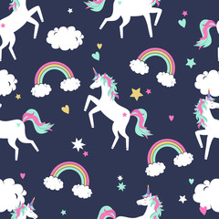 Vector cute seamless pattern with unicorns, rainbows and clouds © Eireen