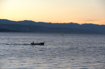 Before sunrise on the beach, early morning seaside activity