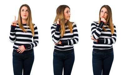 Obraz premium Set of Blonde youn girl having doubts and with confuse face expression