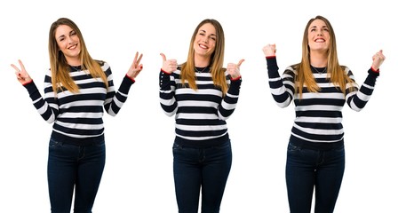Obraz premium Set of Blonde youn girl giving a thumbs up gesture and smiling