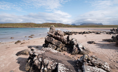 Fototapeta na wymiar Achnahaird Beach in Wester Ross, Scottish Highlands. Quiet, cresent shaped beach on the north west coast of Scotland, with mountains in the background.