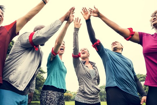 Diverse team stacking their hands
