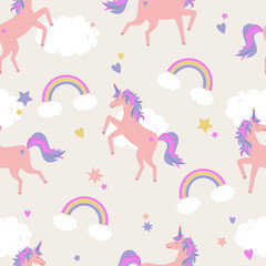 Vector cute seamless pattern with unicorns, rainbows and clouds © Eireen