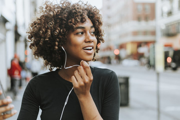 Cheerful woman talking through a headset