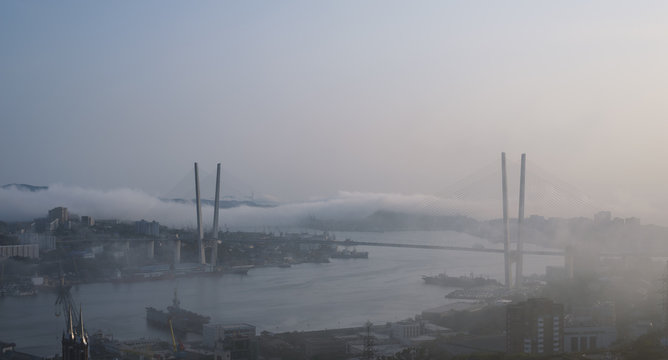 Fog over Vladivostok cityscape.