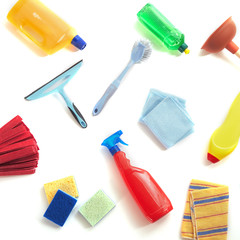 Scattered cleaning products on a white background