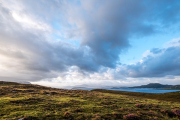 Wide angle view of the mainly uninhabited Summer Isles, taken from the mainland, north of Polbain on the west coast of Scotland. 