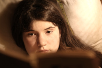 introvert teenager girl reading book