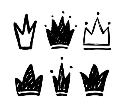 Vector set of abstract silhouettes of crowns. Hand drawn grunge icons isolated