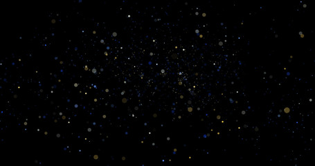 Flying dust particles on a black background