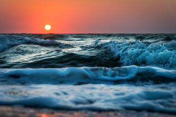 Sea wave close up, sunrise
