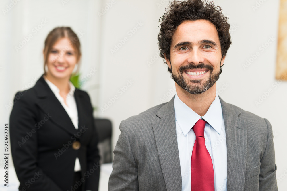 Wall mural Smiling businessman portrait