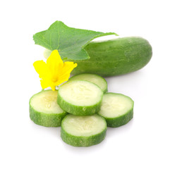 Sliced cucumber with leaf and flower isolated on a white background