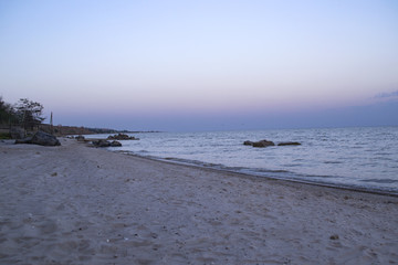 Fototapeta premium Beautiful sunset on the deserted beach. The place for rest and relaxation.