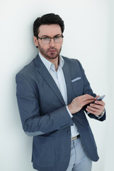 close up.a modern businessman with a smartphone