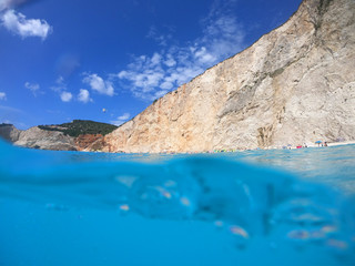 Fototapeta premium Sea level underwater photo of tropical caribbean paradise turquoise beach in exotic island located in an ocean