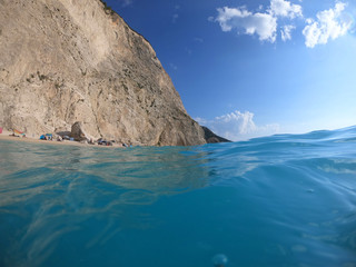 Fototapeta premium Sea level underwater photo of tropical caribbean paradise turquoise beach in exotic island located in an ocean
