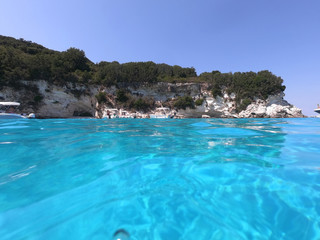 Fototapeta premium Sea level underwater photo of tropical caribbean paradise turquoise beach in exotic island located in an ocean