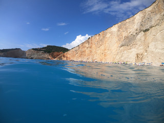 Sea level underwater photo of tropical caribbean paradise turquoise beach in exotic island located in an ocean