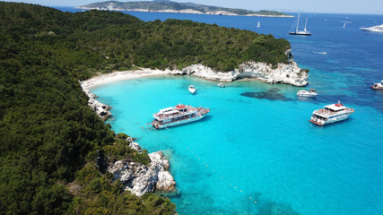 Aerial bird's eye view photo taken by drone of tropical rocky caribbean seascape with sandy beach with turquoise clear waters and small trees