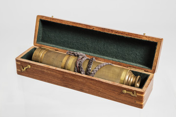 Old binoculars on white background