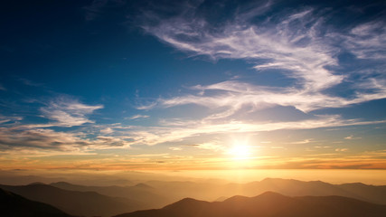 Fototapeta na wymiar Silhouettes of mountains on background of sunset sky