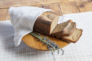 Fototapeta na wymiar Assortment of baked bread on wooden table background