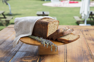 Fototapeta na wymiar Assortment of baked bread on wooden table background