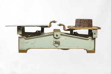 Isolated old weight against a white background.