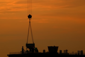 silhouette of construction in the evening on the sunset