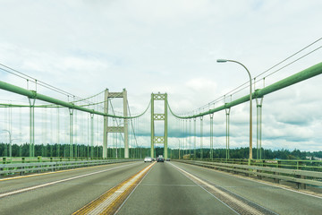 Obraz premium scene over the Narrows steel bridge in Tacoma,Washington,USA.