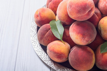 Ripe peaches fruit on rustic background