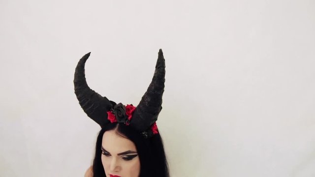 girl in a fairy-tale image with horns on her head