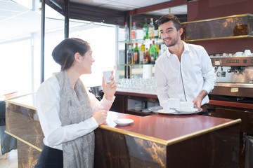 Fototapeta na wymiar barista entertaining a customer
