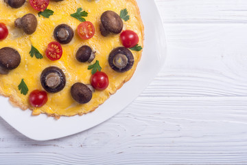 Omelette with mushroom , tomato and parsley