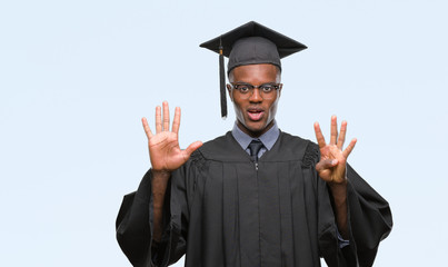 Young graduated african american man over isolated background showing and pointing up with fingers number nine while smiling confident and happy.