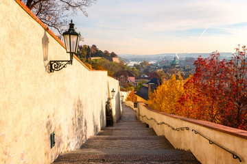 Prague Castle Hill in the autumn morning. Beautiful city view of Old Town and historic bridges....