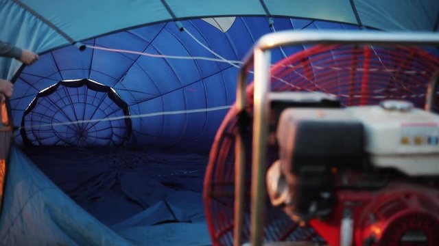 Close up of the balloon filled with gas is preparing for the flight festival burner airship hot sky transportation adventure freedom travel aircraft slow motion