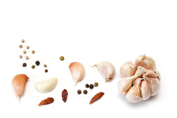 Raw garlic segments and peppers.